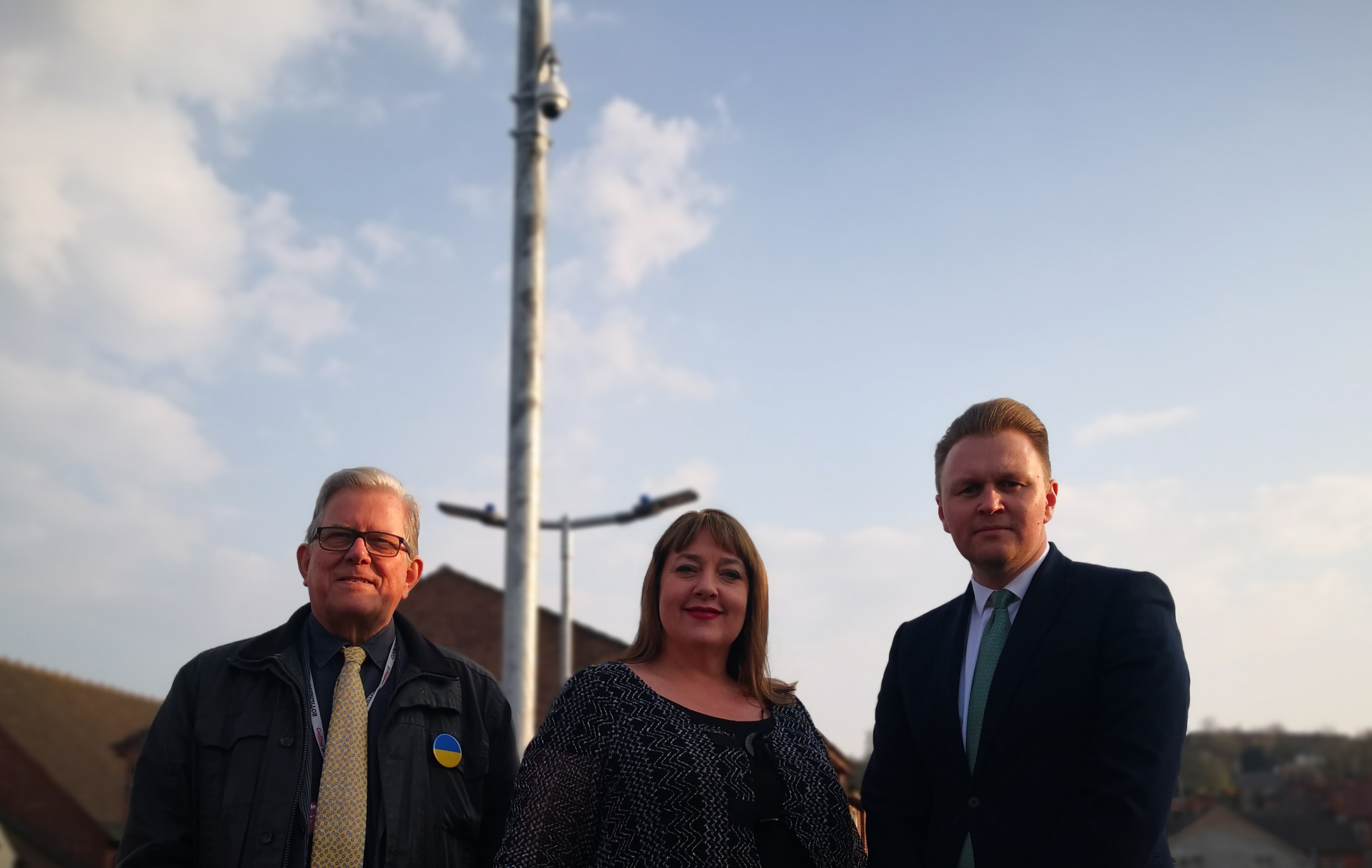 From left to right, Leader of Gedling Borough Council, Councillor John Clarke MBE, Nottinghamshire Police and Crime Commissioner, Caroline Henry and Deputy Leader of Gedling Borough Council, Councillor Michael Payne in front of the new CCTV Camera at Carlton Square